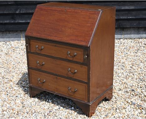An Edwardian mahogany fall front bureau with fitted interior over three long drawers, raised on bracket feet, 76 cm wide x 47