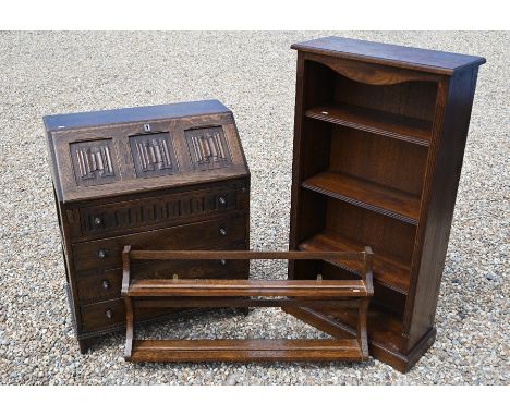 An Ercol linenfold design bureau to/with a plate rack plate and an open bookcase (3)