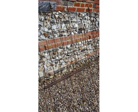 A pair of weathered steel arrow-head garden obelisks, approx. 160 cm high x 37 cm diameter 