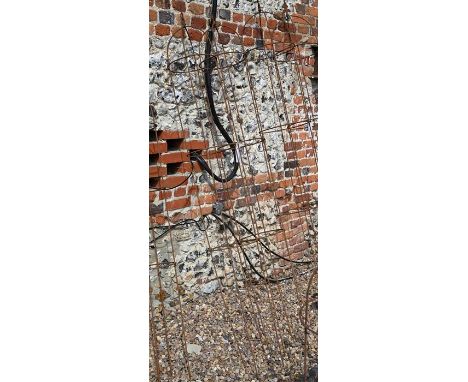 A pair of medium weathered steel arrow-head garden obelisks, approx. 205 cm high x 27 cm diameter 