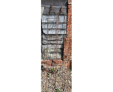 A pair of weathered steel arrow-head garden obelisks, approx. 160 cm high x 23 cm diameter&nbsp;