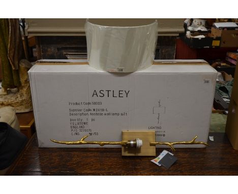 A boxed as new Astley wall light