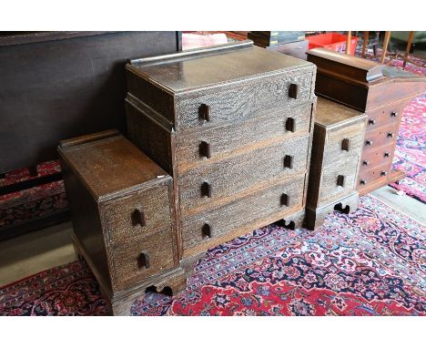 An Art Deco limed oak chest of four graduating drawers with moulded handles, raised on bracket feet in manner of Heals, 75 cm