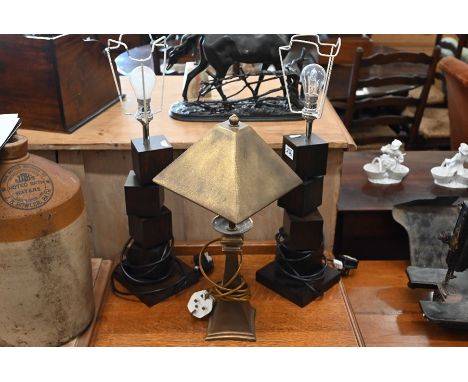 A copper table lamp with pyramid shade, to/w two stained wood 'stacked block' lamps (3)&nbsp;