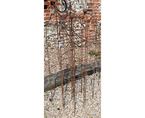 A pair of weathered steel arrow-head garden obelisks to/w a pair of ball-head garden obelisks, approx. 120 high x 27 cm diame