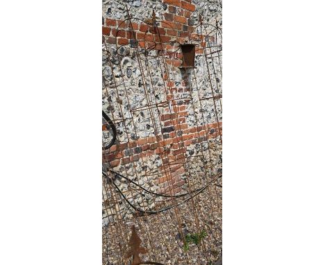 A pair of medium weathered steel arrow-head garden obelisks, approx. 220 cm high x 33 cm diameter 