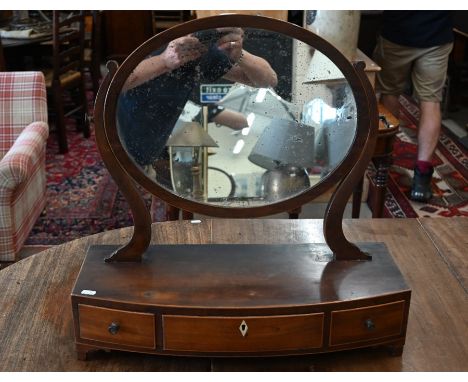 A 19th century mahogany framed oval toilet mirror on three drawer platform base a/f, 58 cm wide x 58 cm high x 23 cm deep