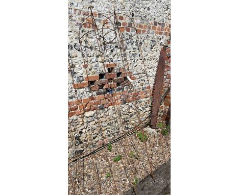 A pair of large weathered steel arrow-head garden obelisks, approx. 220 cm high x 40 cm diameter 