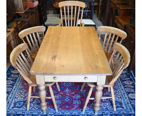 Light oak kitchen/dining table and five chairs (four standard and one carver)