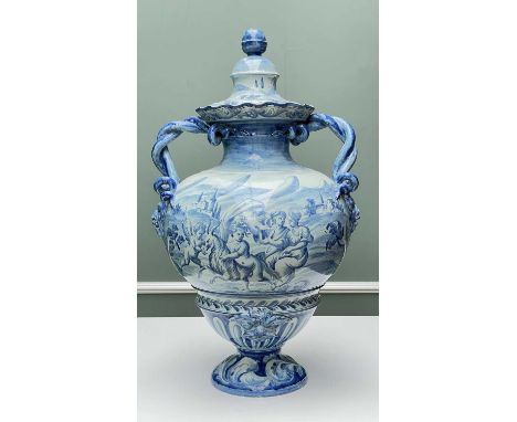 LARGE CANTAGALLI BLUE & WHITE MAIOLICA VASE & COVER, twisted rope and mask handles, decorated with cherubs surrounding a coat