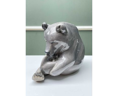 ROYAL COPENHAGEN MODEL OF A BEAR, in seated playful pose, numbered to base '164' & '1233/351', printed marks to base, 15.5cms