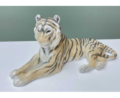 LARGE ROYAL COPENHAGEN MODEL OF BENGAL TIGER, in recumbent pose, model number '714', printed marks to base, 31cms longProvena