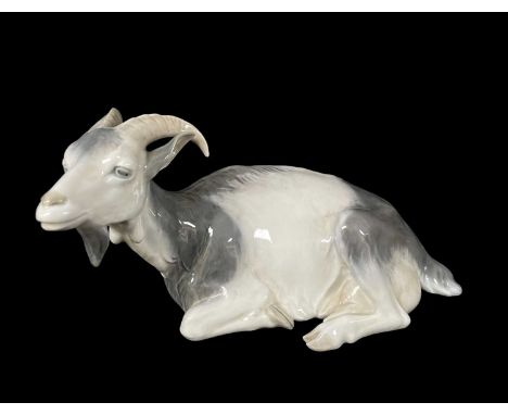 ROYAL COPENHAGEN PORCELAIN MODEL OF A GOAT, designed by Christian Thomsen, recumbent facing slightly to sinister, no. 466, 28