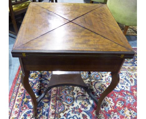 An early 20th century inlaid walnut card table, with envelope folding top and single drawer, 82 x 82 x 72 cm H. Not available