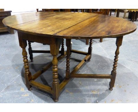 An 18th century country oak gate leg table with turned supports and single drawer, 149 x 121 x 75 cm H (open). Not available 