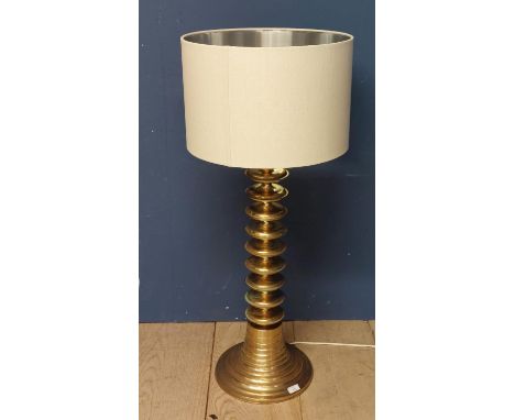 A Contemporary brass lamp with twist design column, and a cream shade, height overall 110cm; some minor wear to metal work; e