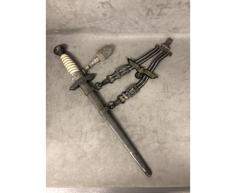 A German Luftwaffe second pattern officers Dagger, cast pommel and wire wrapped grip with spread eagle swastika cross guard w