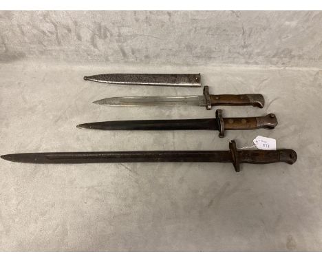 Three WW1 and WW2 rifle bayonets, one with original scabbard, longest 55cm 