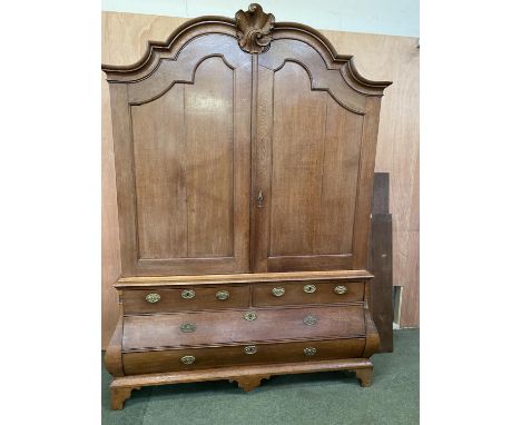 Very large French oak bombe commode style linen press/chest, with domed top and shell finial decoration 