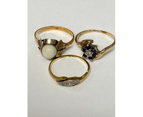 An C18ct gold and diamond three stone ring, a 18ct gold and pearl set ring, and a 9ct gold sapphire and diamond flower ring, 