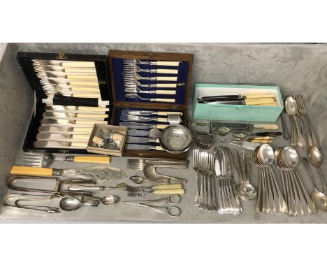 A large collection of silver plated wares to include boxed sets caddy spoons, asparagus tongs and other items 