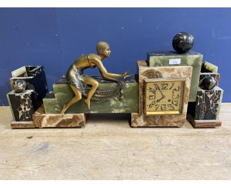 An  Art Deco Onyx, marble and gilt metal mantle clock with matching garniture  by MAEGHT DUNKERQUE, 61 x 33 cm clock; 
