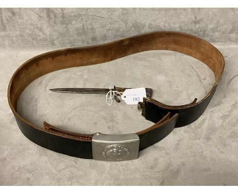 German army leather belt and tin buckle marked EINIGKEIT REIHEIT RECHT (unity justice and freedom), and a German army boot kn