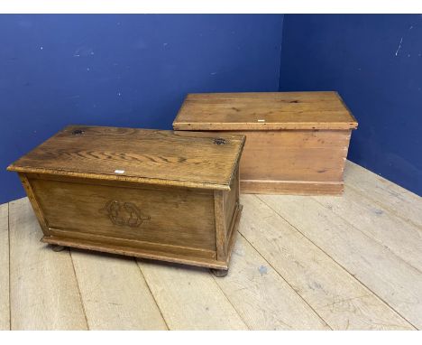 A pine and a light oak blanket box /toy chests, with rising lids(2), 1 handle missing 
