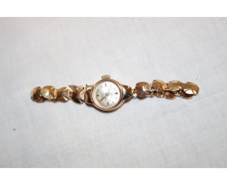 A ladies' 9ct gold wristwatch by Rotary with 9ct gold strap (11.1g)