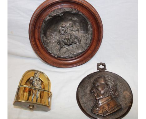 A silver plated circular relief decorated plaque depicting Mary, Joseph and Jesus, 6½" diameter in oak frame; an unusual bras