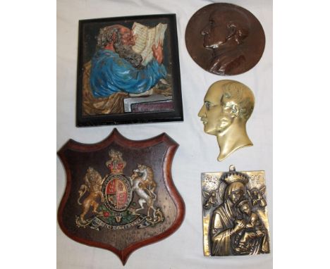 A painted iron shield-shaped plaque with Victorian coat of arms decoration, cast brass ikon-style rectanglar plaque, bronze c