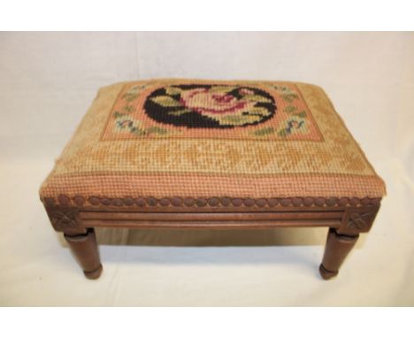 A Victorian carved beech rectangular footstool with floral tapestry upholstered seat, 13" long