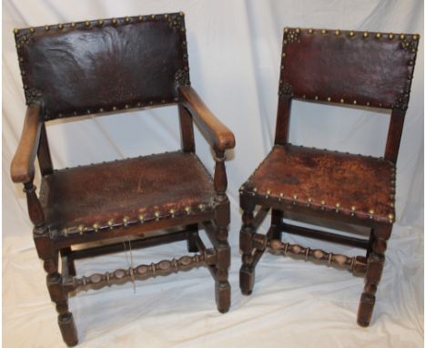 A pair of 19th century oak country-style dining chairs upholstered in leather on bobbin turned supports