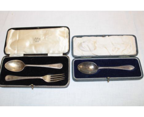A silver Christening spoon and fork with feather-edged handles, Sheffield marks 1936 in lined case and one other silver cased