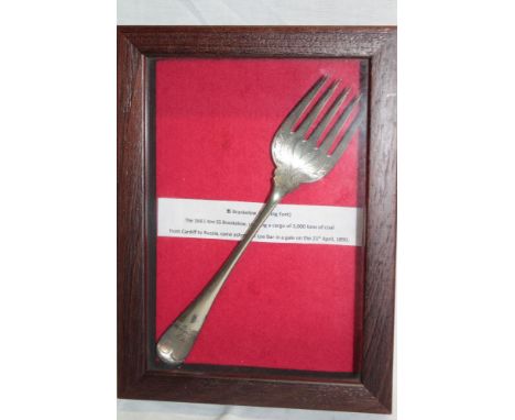 A Victorian silver-plated serving fork marked "S.S. Brankelow" in glazed display case (The 1661 Ton S.S. Brankelow carrying a