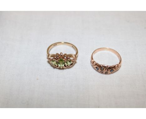 A 9ct gold dress ring set peridot and one other 9ct gold dress ring set sapphires and pearls (one missing) (6g)(2)