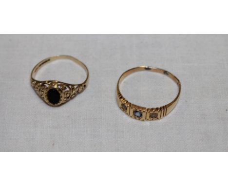 An 18ct gold dress ring set topaz and pearl (2.3g) and a 9ct gold dress ring set obsidian (1.2g) (2)