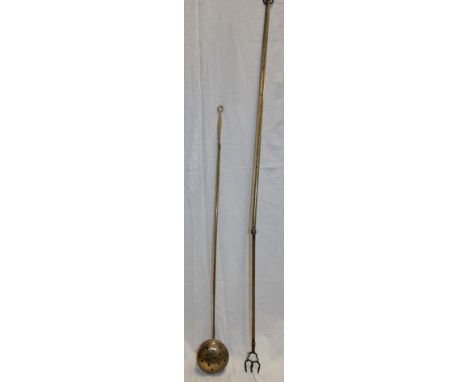 An old brass telescopic toasting fork, 40" long and a small brass chestnut roaster (2)