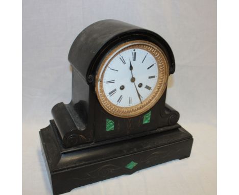 A Victorian mantel clock with circular enamelled dial in black slate and malachite domed case
