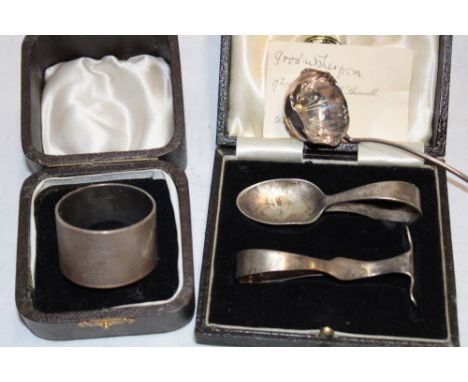 A George V silver circular napkin ring with engraved initials, Sheffield marks 1935 in velvet lined case, silver sifting spoo