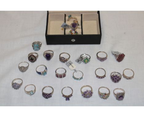 A jewellery box containing 25 various silver dress rings set semi-precious gemstones