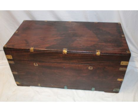 A brass mounted camphor rectangular trunk with hinged lid and brass handles 38" long