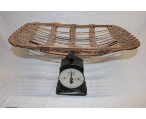 A Boots family scale to weigh 200 lbs by 1 oz with wicker platform basket