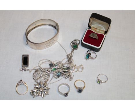 A selection of silver dress rings, silver jewellery including ornate circular pendant, silver oval bangle, etc