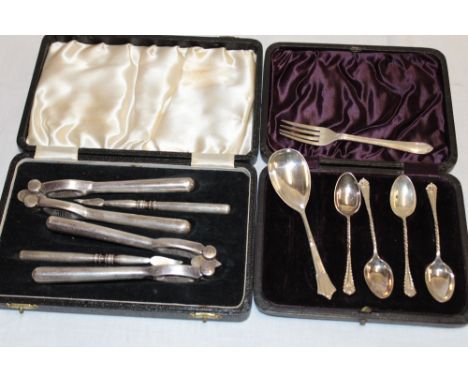 A silver-plated cased double nutcracker set with picks and a small selection of various silver cutlery (2)