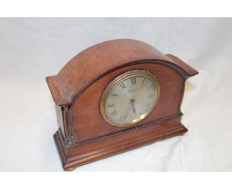 A good quality mantel clock with silvered circular dial by Robinson & Co. of Shrewsbury in arched mahogany case