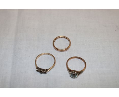 A 9ct gold wedding band, 9ct gold dress ring and one other