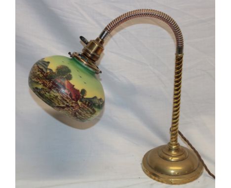 A 1920's/30's brass adjustable desk lamp with landscape scene opaque glass circular shade