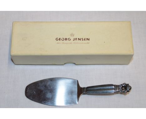 A Danish silver serving slice by Georg Jensen with fluted handle, 6½" long in makers box