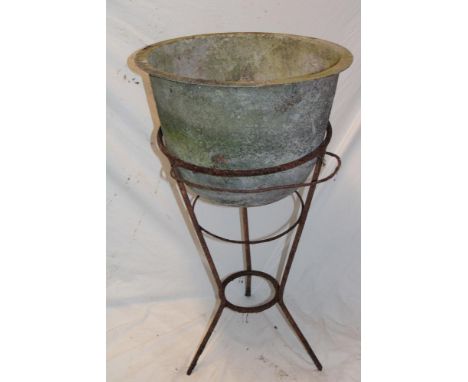 A 19th century iron circular tapered basin on wire-work stand, 19" diameter